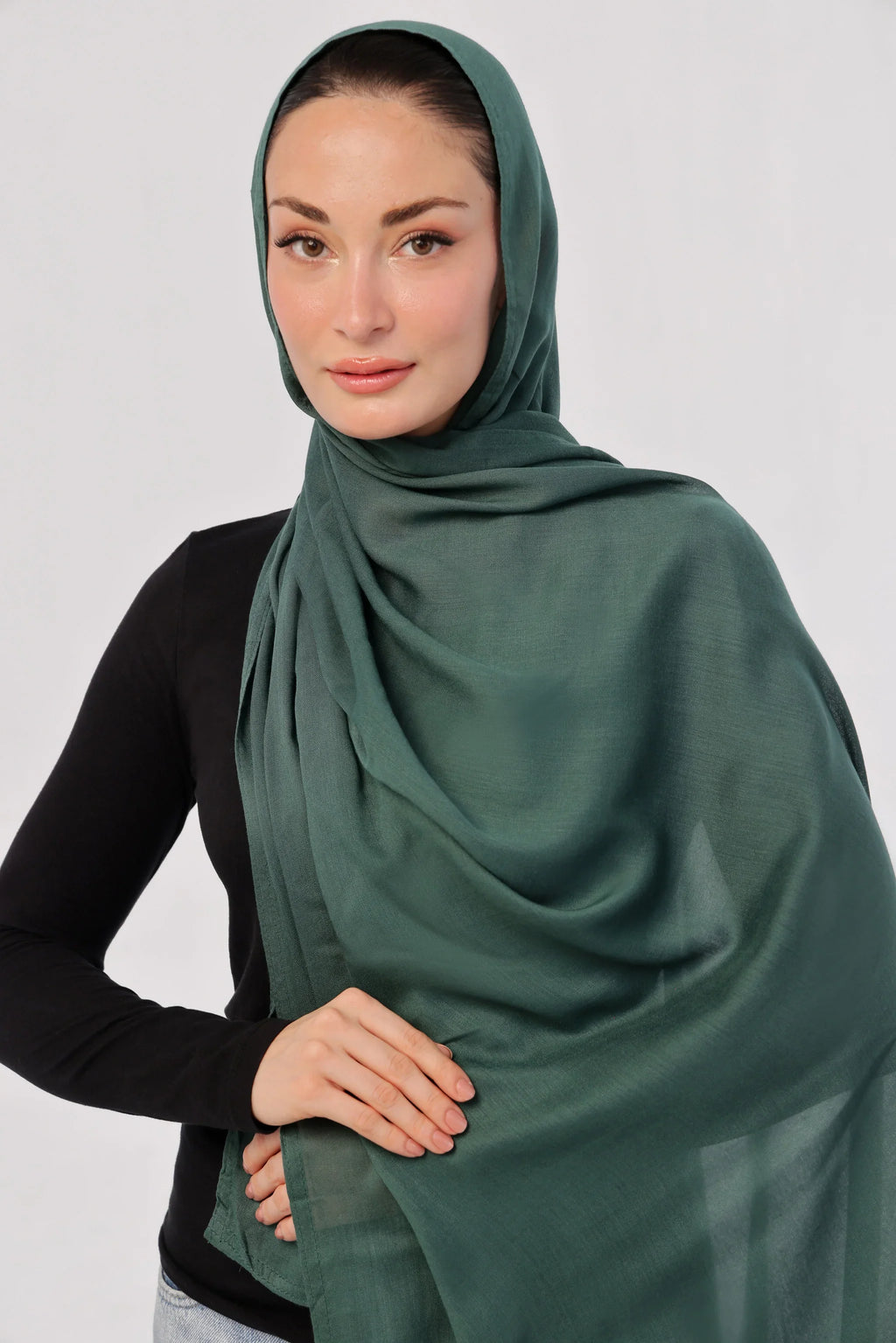 Bottle Green Modal Hijab - worn by model, lightweight and flowy drape.