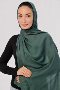 Bottle Green Modal Hijab - worn by model, lightweight and flowy drape.