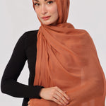 Burnt Orange Modal Hijab - worn by model, lightweight and flowy drape.