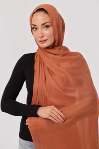 Burnt Orange Modal Hijab - worn by model, lightweight and flowy drape.