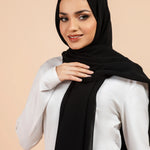 Premium Georgette - Black Georgette Hijab worn by model, lightweight and flowy drape.