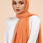 Premium Georgette - Coral Bliss Georgette Hijab worn by model, lightweight and flowy drape.