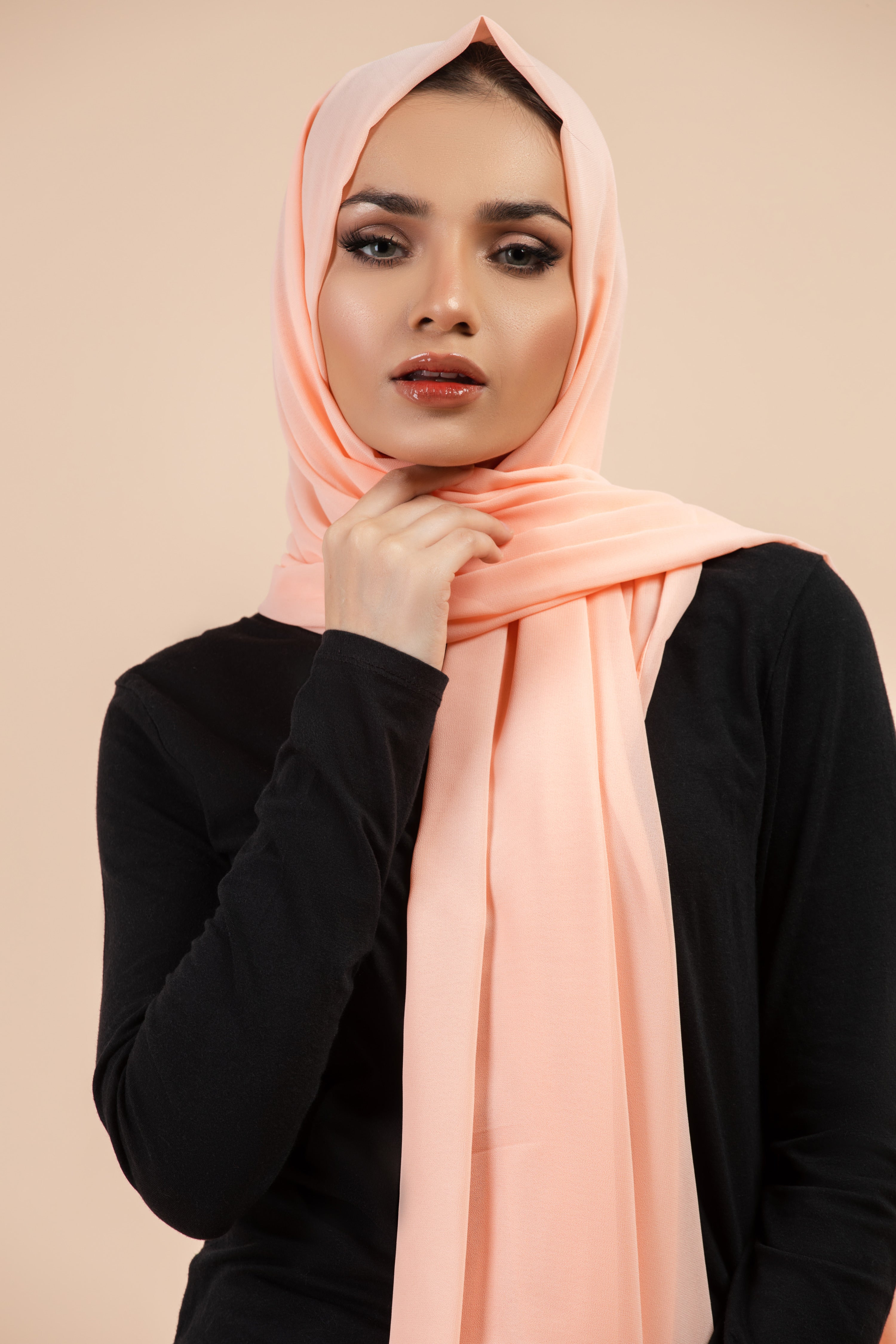Premium Georgette - Creamy Peach Georgette Hijab worn by model, lightweight and flowy drape.
