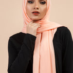 Premium Georgette - Creamy Peach Georgette Hijab worn by model, lightweight and flowy drape.