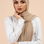 Premium Georgette - Khaki Georgette Hijab worn by model, lightweight and flowy drape.