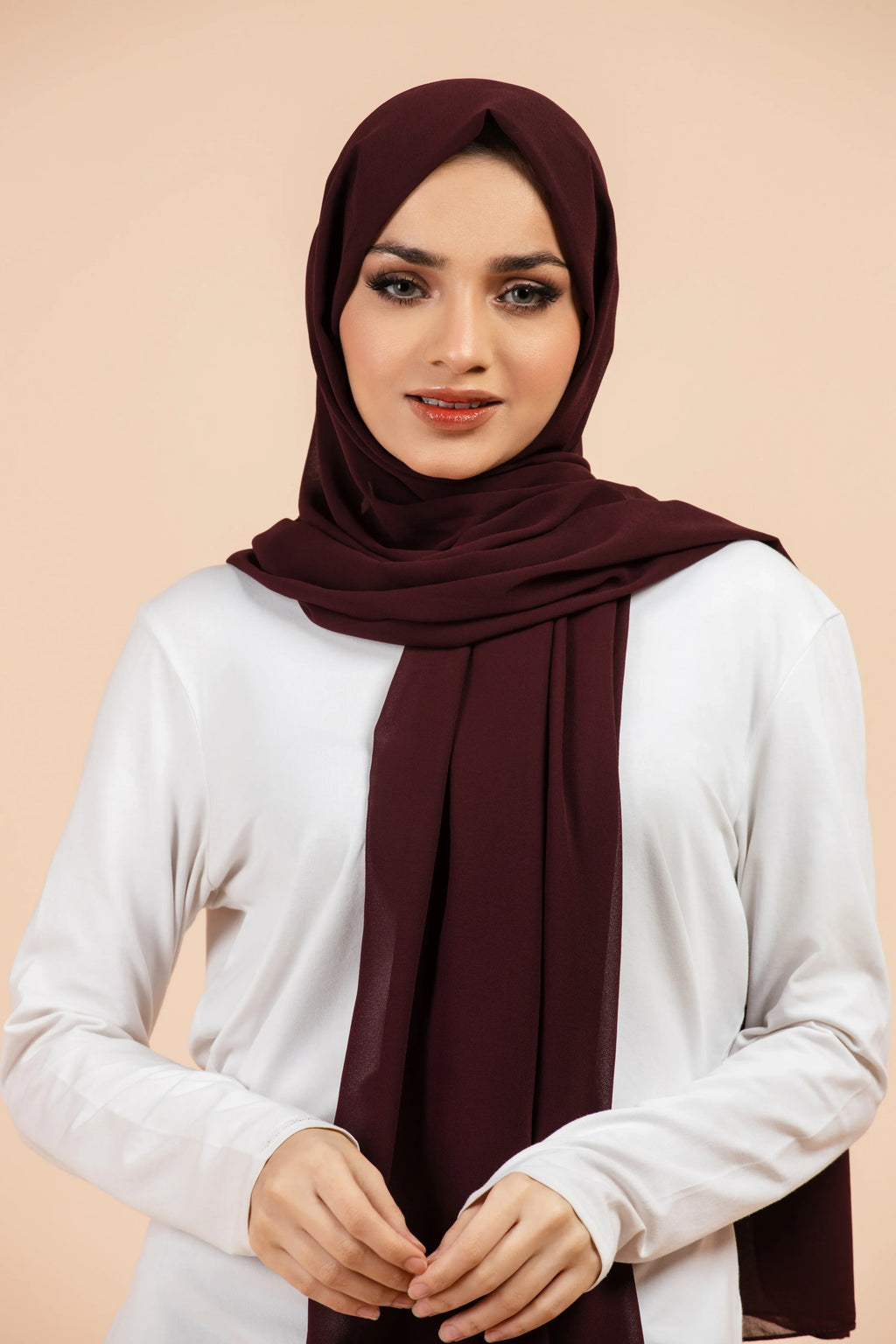 Premium Georgette - Mahogany Georgette Hijab worn by model, lightweight and flowy drape.