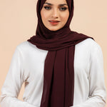 Premium Georgette - Mahogany Georgette Hijab worn by model, lightweight and flowy drape.