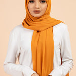 Premium Georgette - Mustard Georgette Hijab close-up of smooth georgette fabric texture.