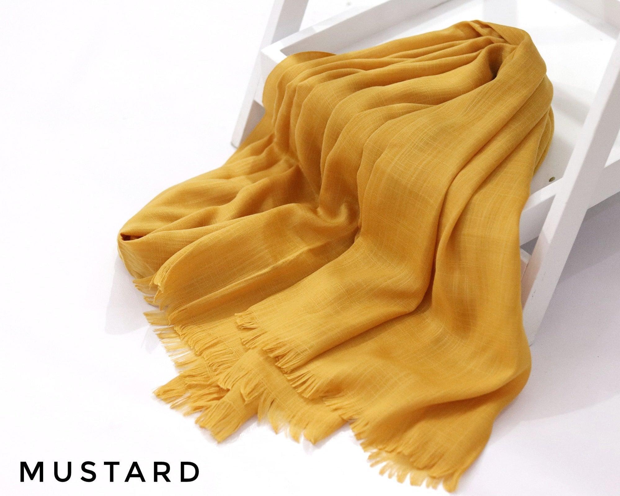 Mustard Turkish Viscose Hijab close-up of smooth Turkish viscose texture.