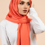 Premium Georgette - Neon Peach Georgette Hijab worn by model, lightweight and flowy drape.