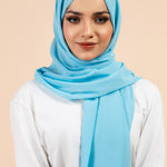 Premium Georgette - Pacific Blue Georgette Hijab worn by model, lightweight and flowy drape.