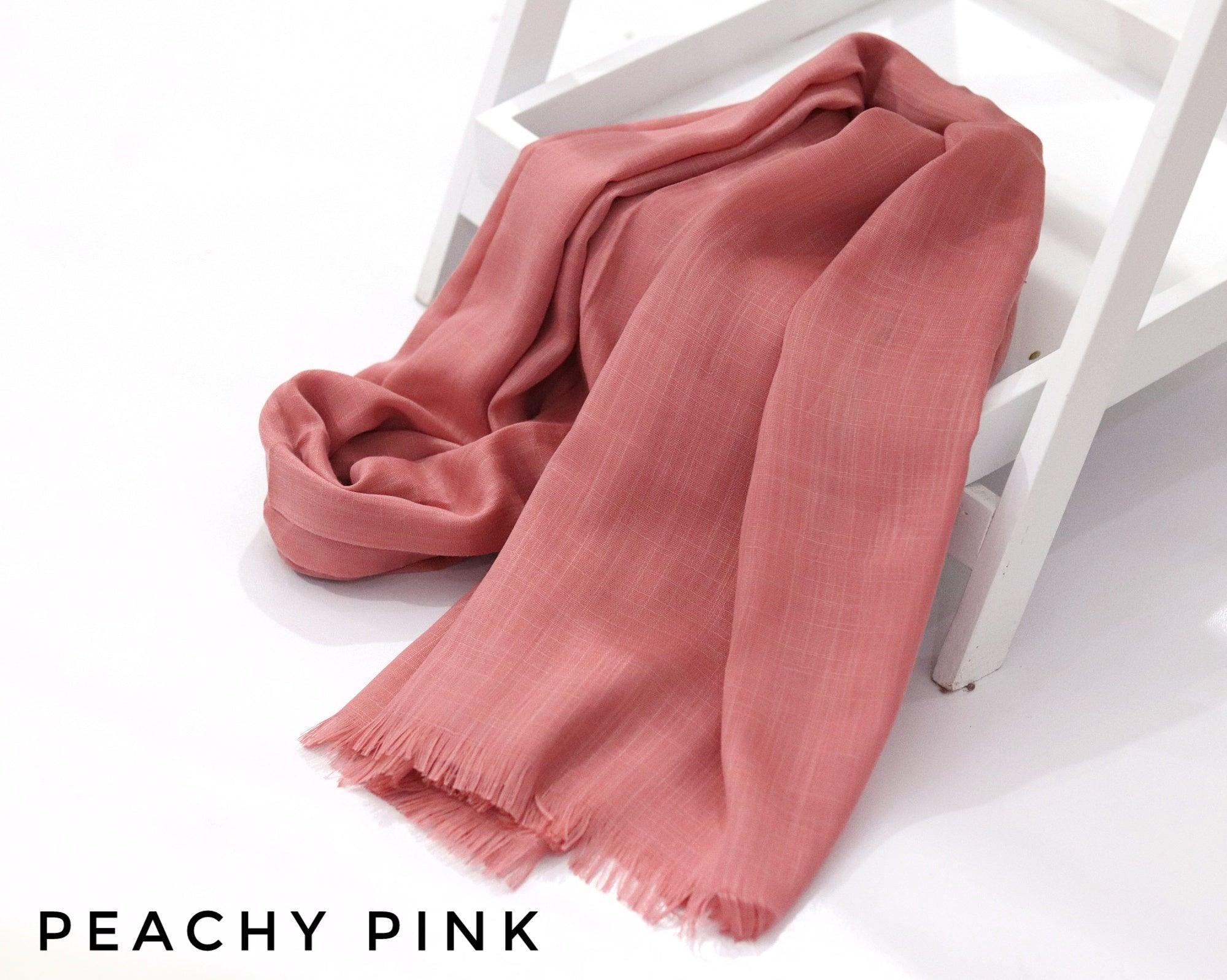 Peachy Pink Turkish Viscose Hijab close-up of smooth Turkish viscose texture.
