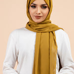Premium Georgette - Pickle Georgette Hijab worn by model, lightweight and flowy drape.