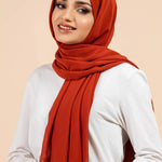 Premium Georgette - Rust Georgette Hijab worn by model, lightweight and flowy drape.