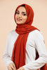 Premium Georgette - Rust Georgette Hijab worn by model, lightweight and flowy drape.