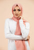 Premium Georgette - Warm Peach Georgette Hijab worn by model, lightweight and flowy drape.